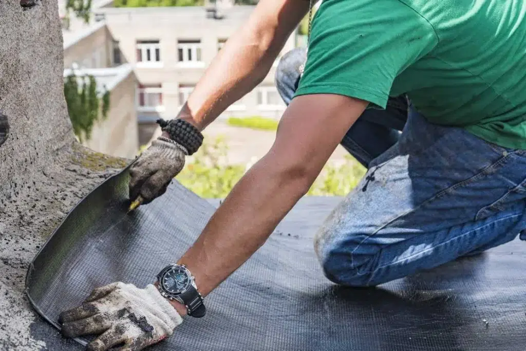 worker performs overhaul roof residential building 1